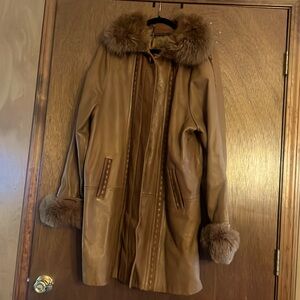 Woman’s leather coat with fur collar that comes off and arms come off